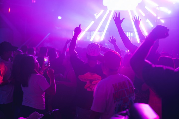 a group of people on a stage playing a video game